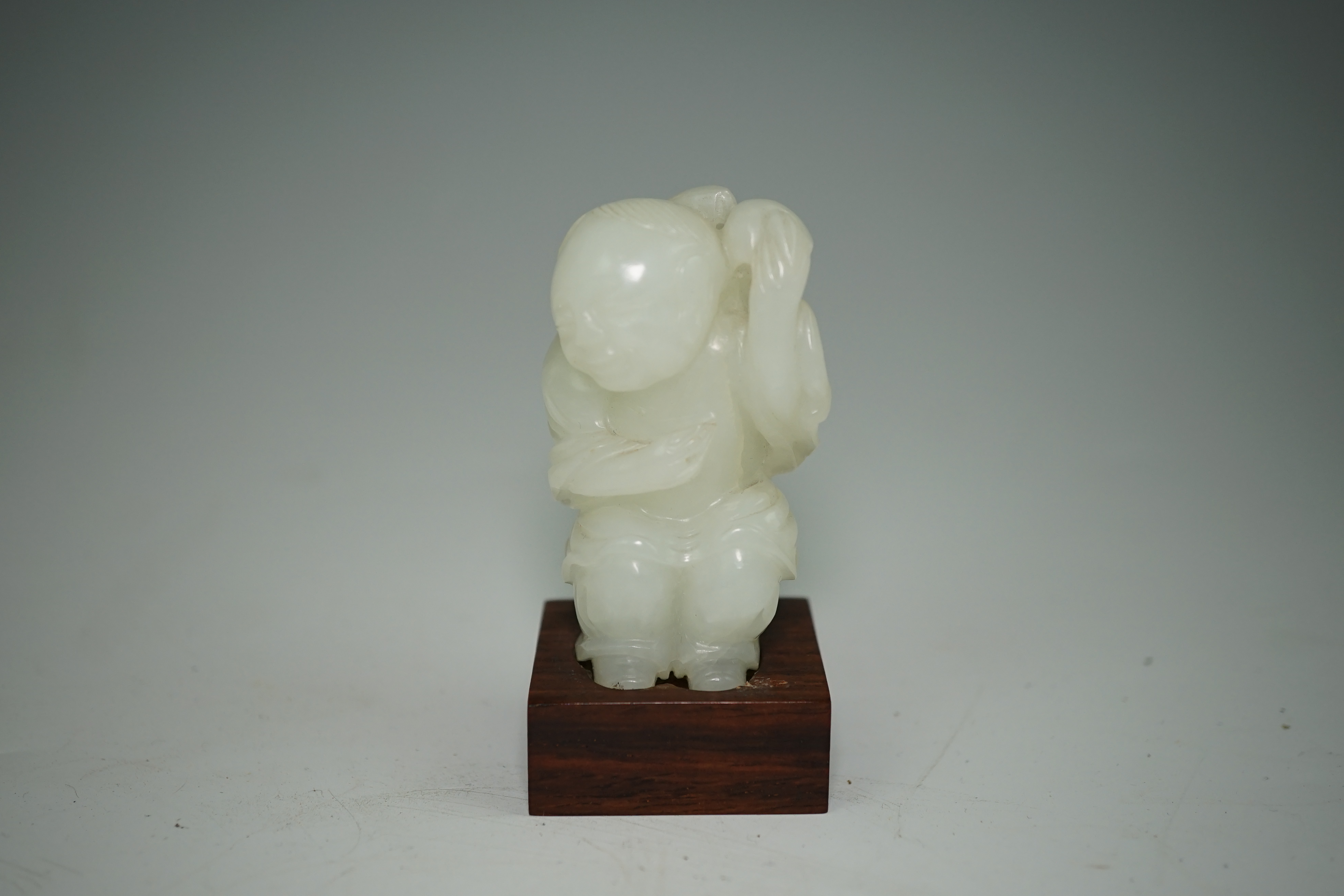 A Chinese white jade figure of Liu Hai, 18th-19th century